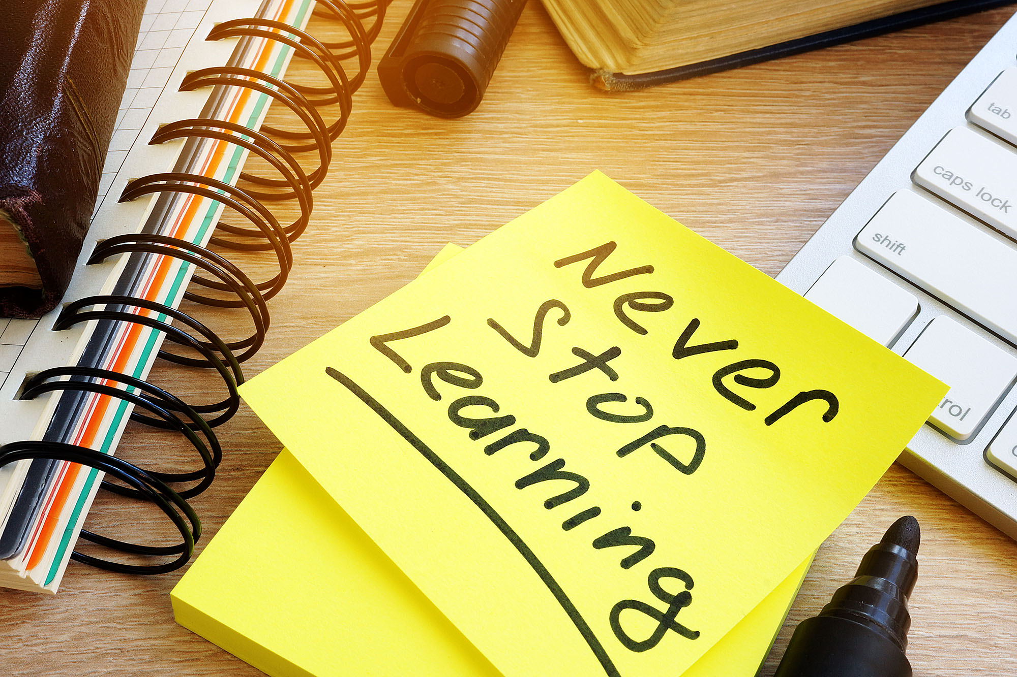 Image of a sticky note reading "Never Stop Learning."