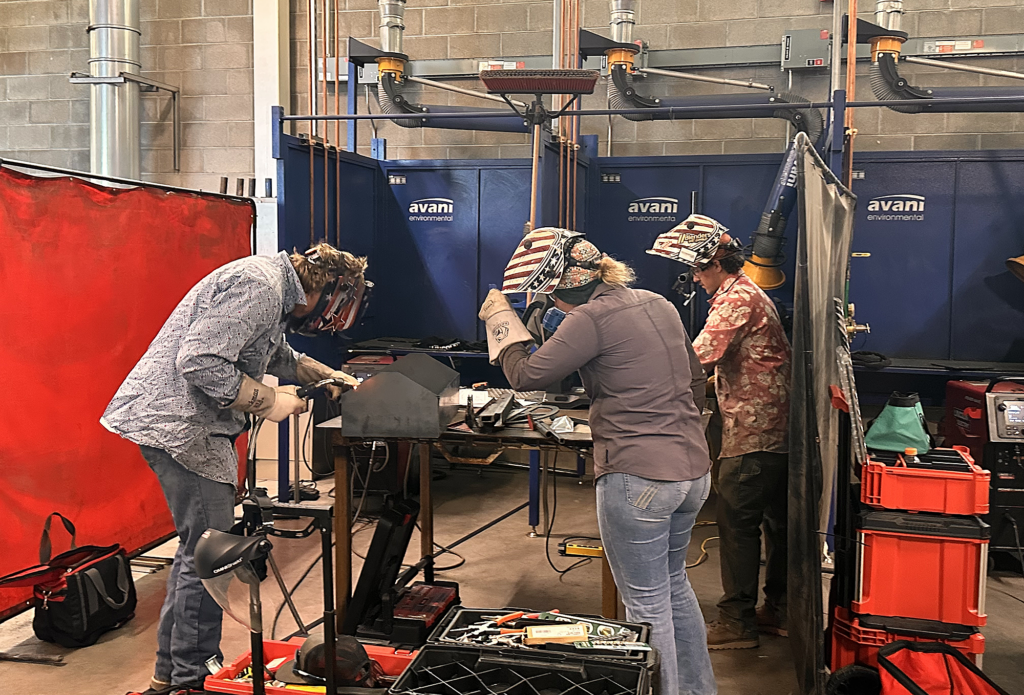 Photo of three Casper College students, Jackson Berg, Chloe Pruitt, and Ashur Logan. Photo used for a press release on winners of the statewide SkillsUSA contest.