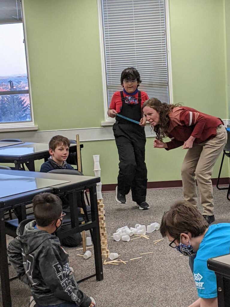 students build a tower using toothpicks and plastic cups