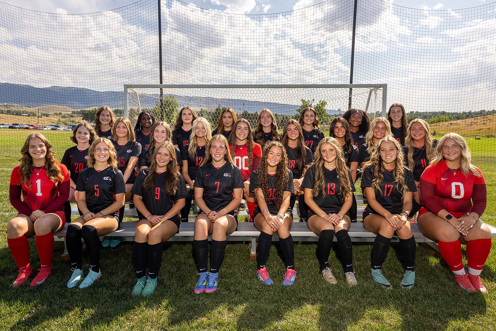 Casper College women's soccer team portrait on the field in front of a soccer net.