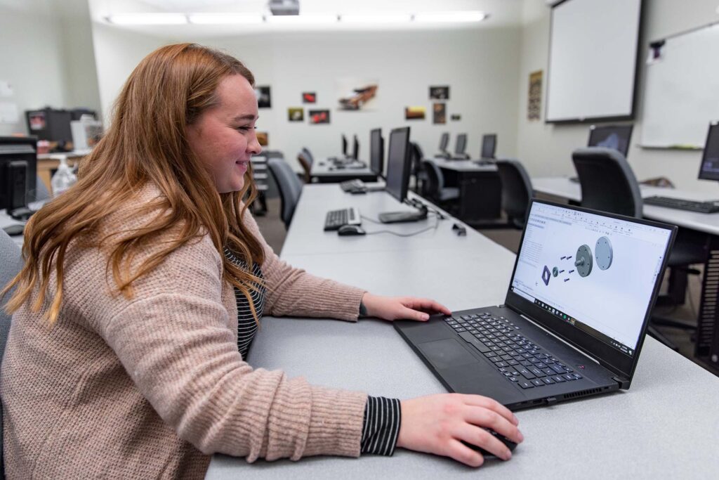 A student designs a 3D mechanical assembly using industry-standard CAD software, developing the technical skills needed for engineering, manufacturing, and product design.