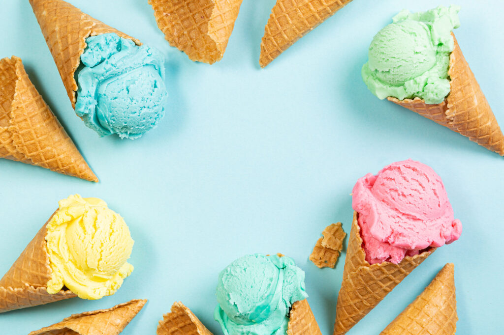 Free ice cream social July 28 at Casper College — colorful waffle cones on a pastel blue background.