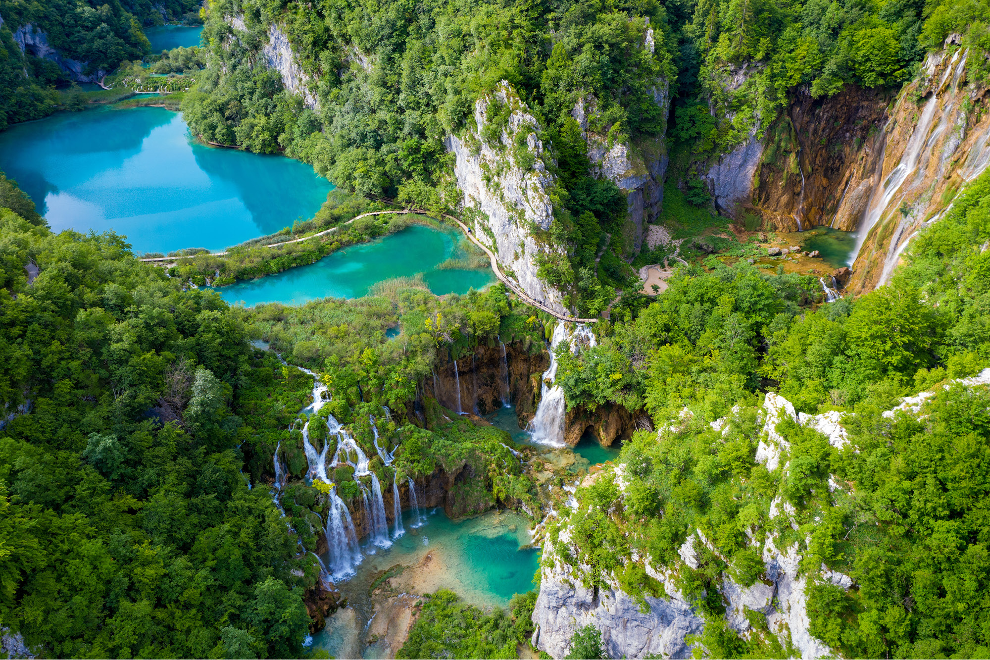 Aerial view of Plitvice Lakes waterfalls and wooden footpaths for the Treasures of Croatia and Slovenia trip.
