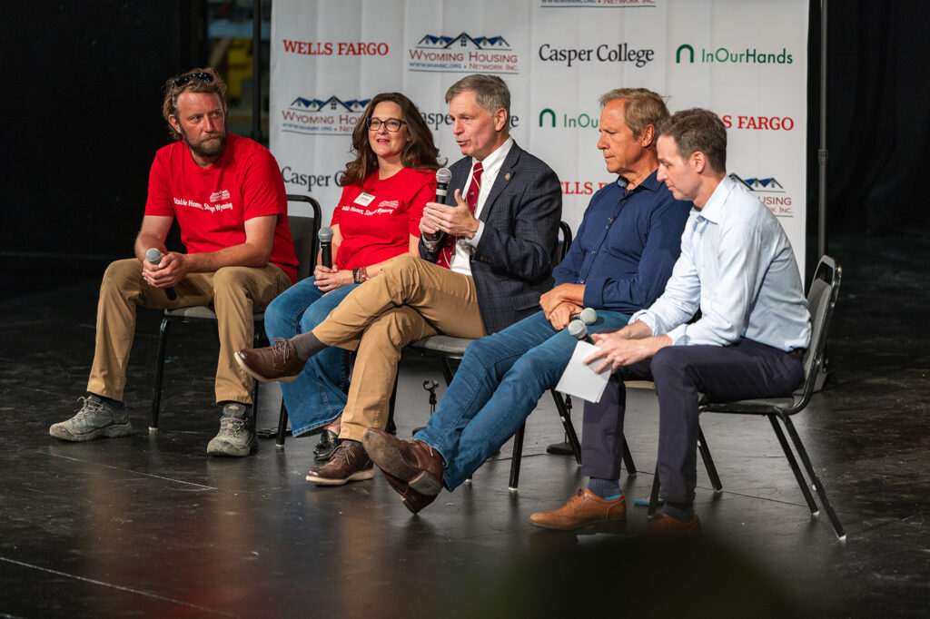 A panel discussion at Casper College featuring Governor Mark Gordon and Mike Rowe regarding the Wyoming Housing Network grant.