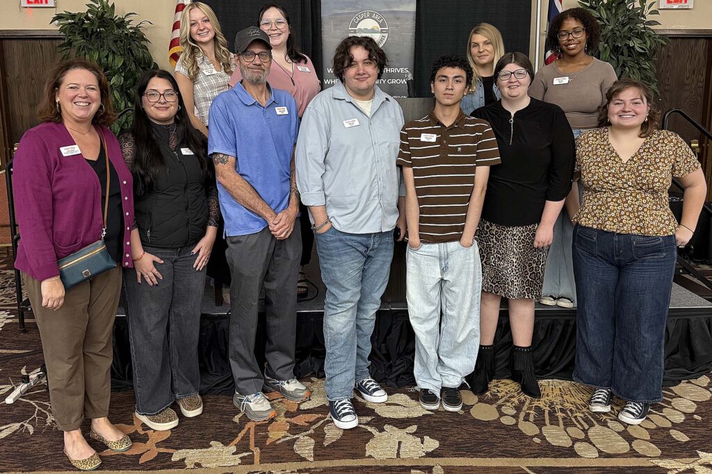Casper College marketing students and faculty pose at the Casper Area Chamber of Commerce 2026 State of the Community luncheon.