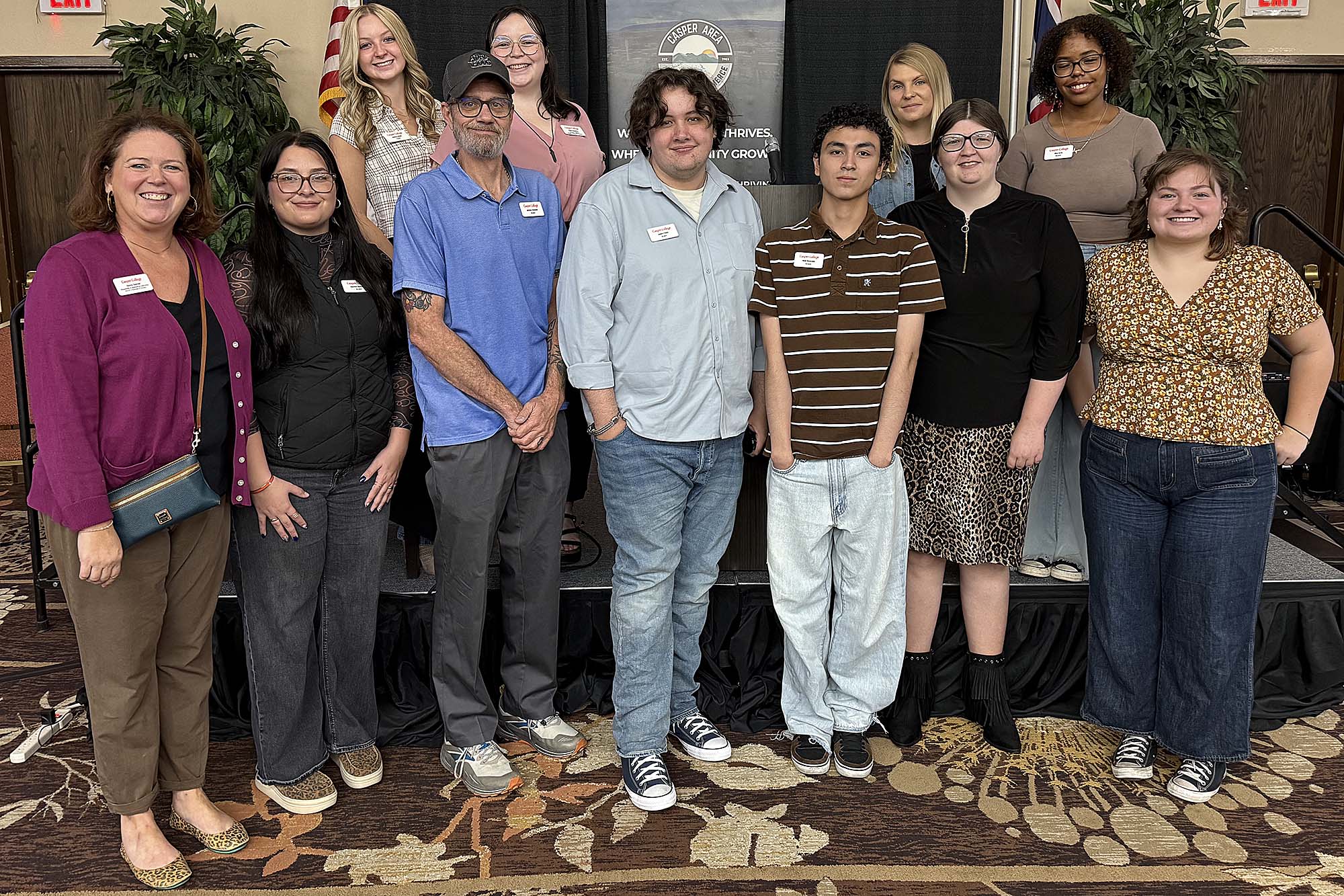 Casper College marketing students and faculty pose at the Casper Area Chamber of Commerce 2026 State of the Community luncheon.