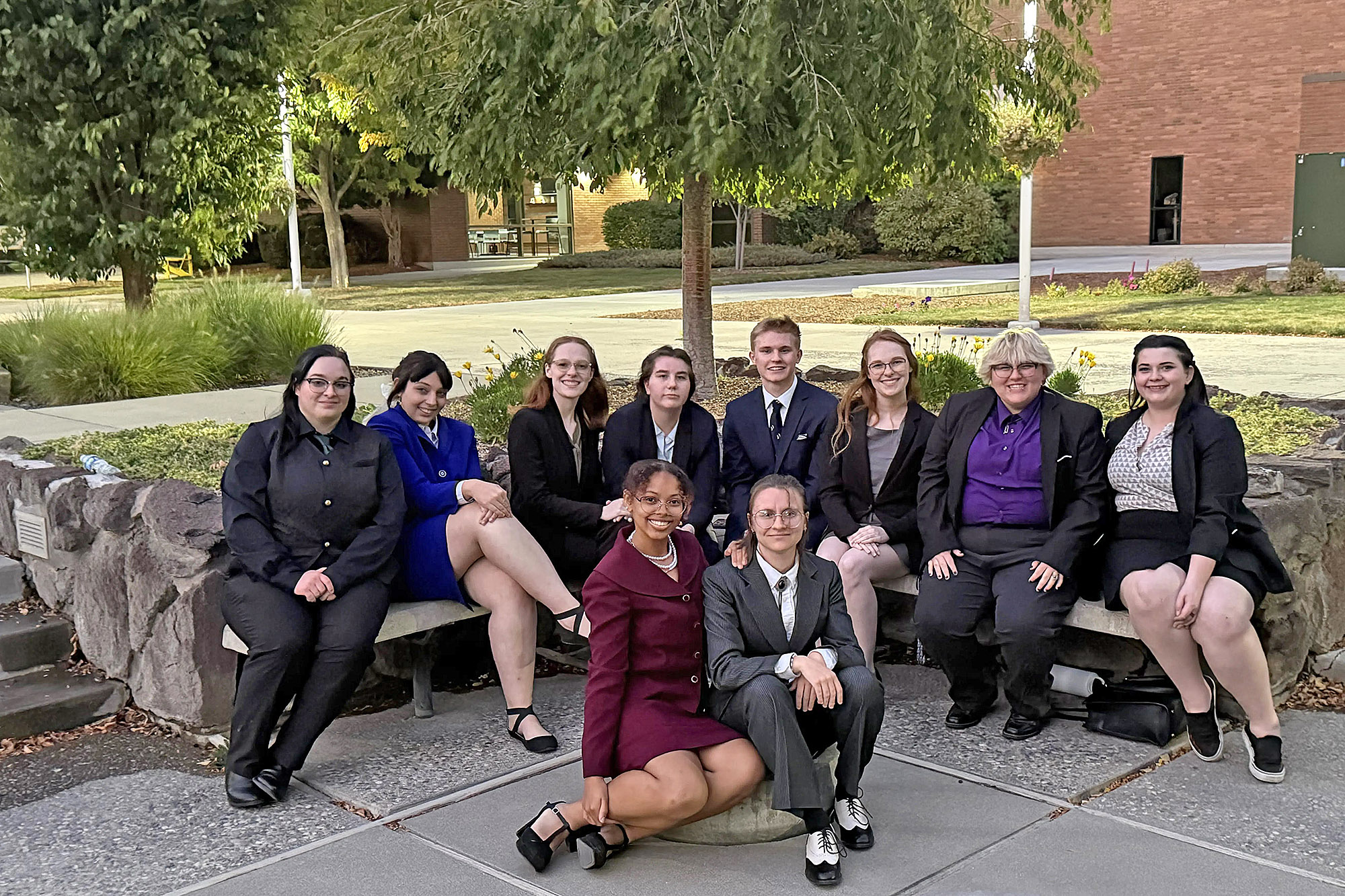 Text Casper College forensics team members at the Fran Tanner Invitational award ceremony.